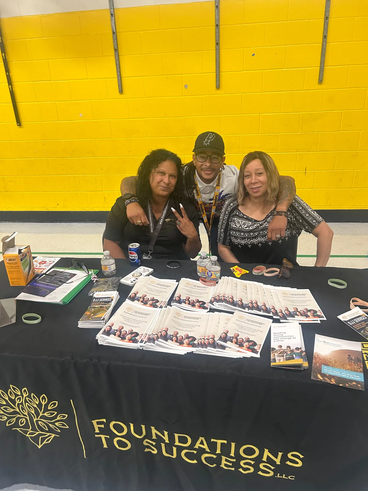 Foundations To Success team members welcoming families at their community information table